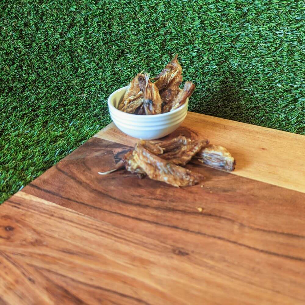 Pile of crunchy Australian Chicken Wing Tip dental treats ideal for puppies and small dogs | Bonza Dog Treats