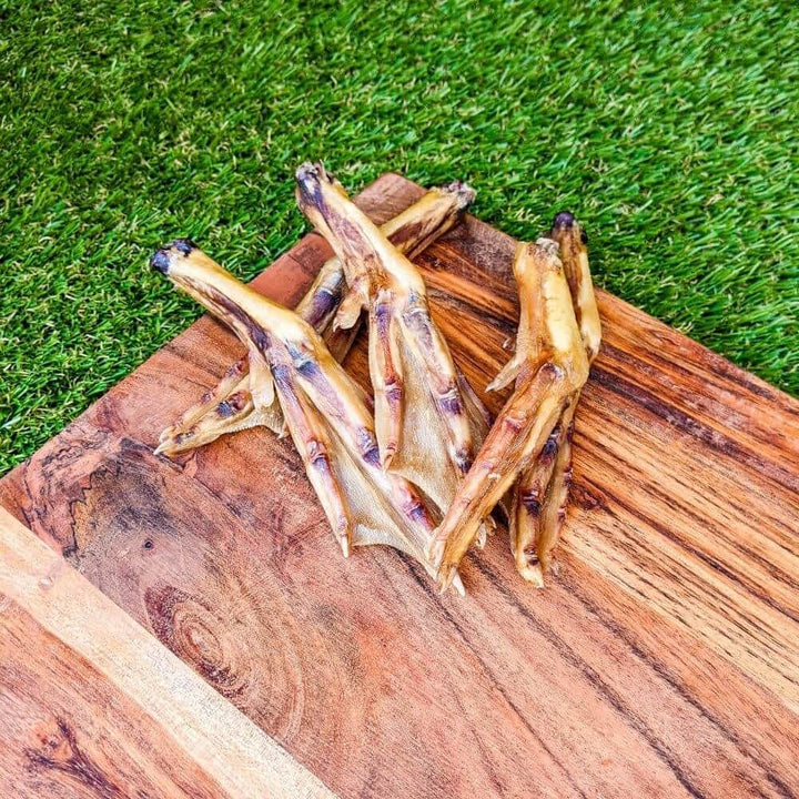 Pile of crunchy 100% Australian Duck Feet rich in chondroitin for dog joint health | Bonza Dog Treats