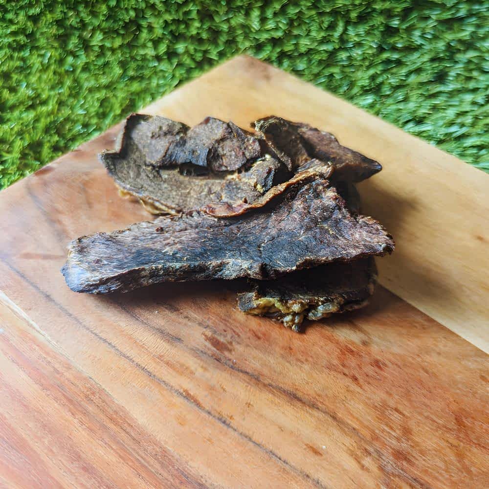 Pieces of Australian Emu Jerky, a low-fat, high-iron, hypoallergenic novel protein treat | Bonza Dog Treats