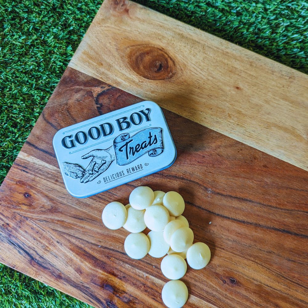 Retro good boy dog treats tin and yogurt drops displayed on wooden board Bonza Dog Treats