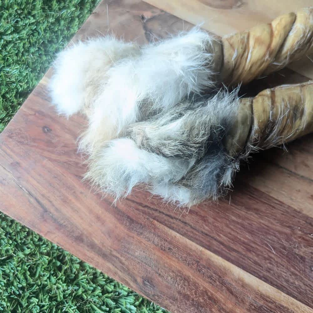 Ends of Whole Rabbit Skin Twist with Fur On, a durable novel protein chew for dogs that supports anal gland health and dental plaque removal | Bonza Dog Treats