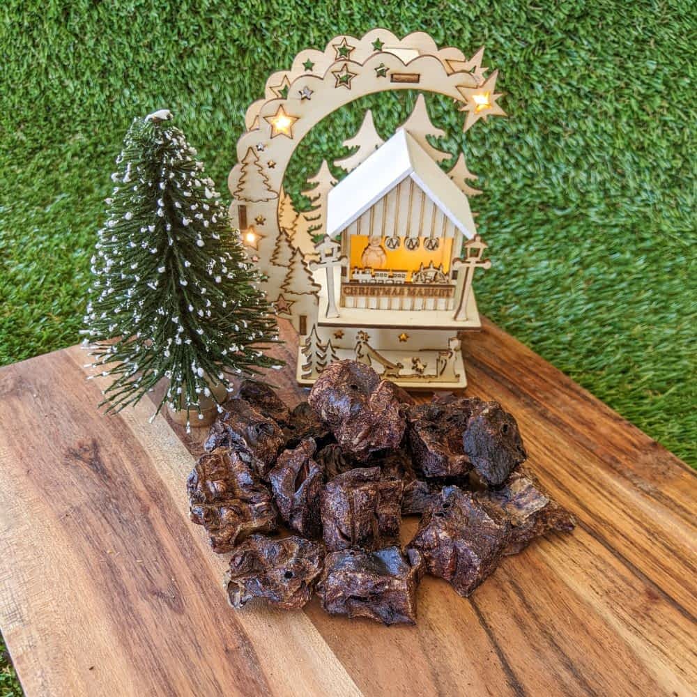 Pieces of Reindeer Poop, a low-fat venison jerky cube Christmas treat for dogs with allergies, ideal for training rewards | Bonza Dog Treats