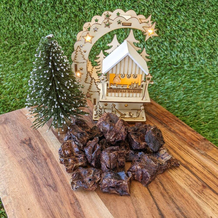 Pieces of Reindeer Poop, a low-fat venison jerky cube Christmas treat for dogs with allergies, ideal for training rewards | Bonza Dog Treats