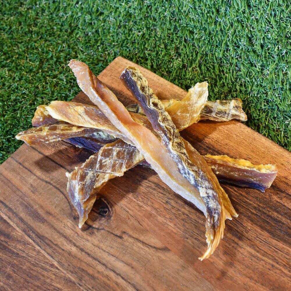Strips of Australian Flake Shark Jerky, a low-fat, Omega-3 rich dental chew for dogs