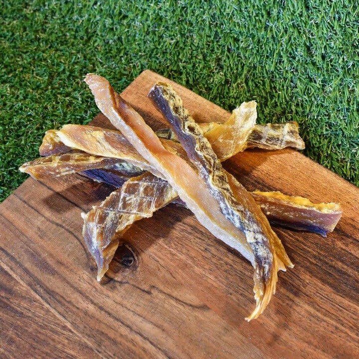 Strips of Australian Flake Shark Jerky, a low-fat, Omega-3 rich dental chew for dogs