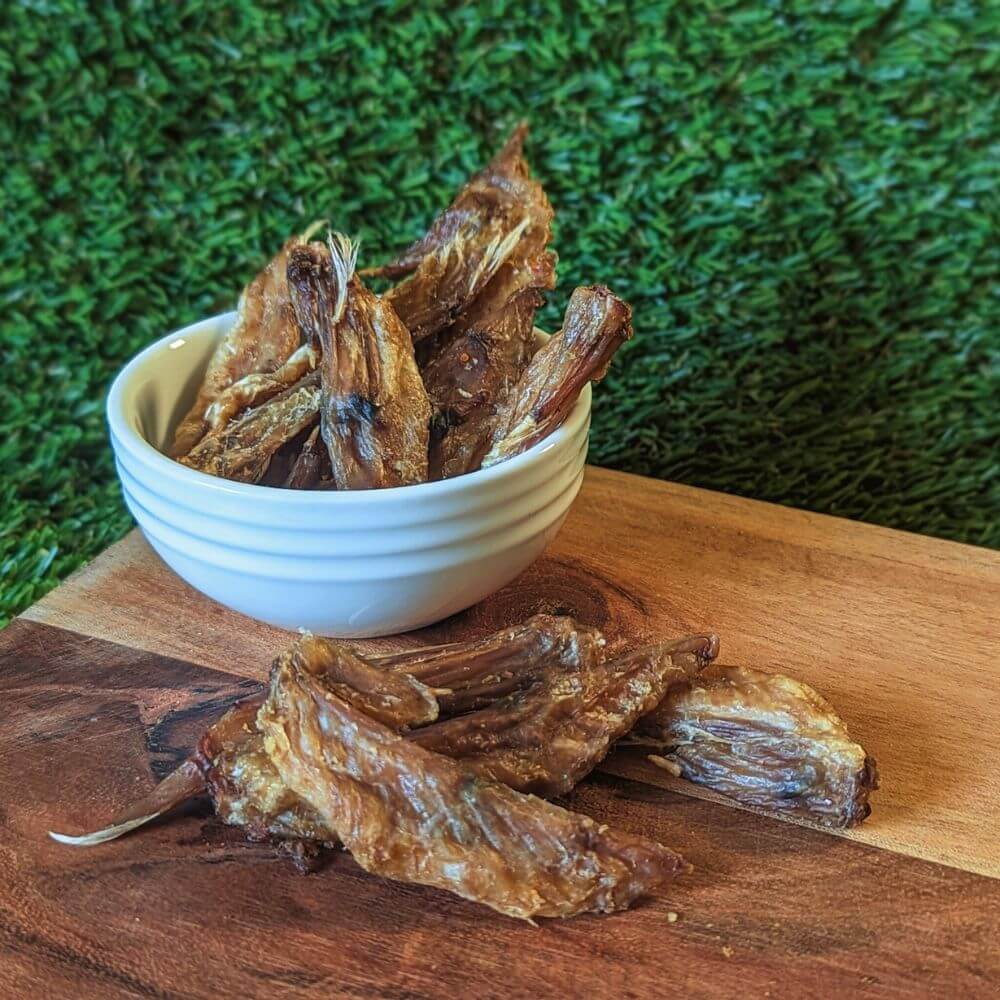 Pile of crunchy Australian Chicken Wing Tip dental treats ideal for puppies and small dogs | Bonza Dog Treats